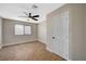 Spacious bedroom featuring a ceiling fan and a window letting in natural light at 1904 Roxbury Ln, Las Vegas, NV 89119