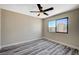 Bedroom features include hard surface flooring, a modern ceiling fan and natural light at 1904 Roxbury Ln, Las Vegas, NV 89119