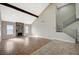 Bright living room boasts high ceilings, a stone fireplace, and modern staircase at 1904 Roxbury Ln, Las Vegas, NV 89119