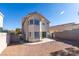 This home has a large, secure backyard with desert landscaping, concrete patio, and block wall fencing at 1989 Bookbinder Dr, Las Vegas, NV 89108