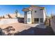 The private backyard has desert landscaping and a concrete patio, perfect for outdoor enjoyment at 1989 Bookbinder Dr, Las Vegas, NV 89108