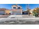 Charming two-story home with a tile roof and well-maintained front yard at 1989 Bookbinder Dr, Las Vegas, NV 89108