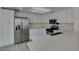 Bright kitchen features white cabinets, stone countertops and stainless steel appliances at 1989 Bookbinder Dr, Las Vegas, NV 89108