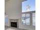 Bright living room features vaulted ceilings, fireplace, and large window at 1989 Bookbinder Dr, Las Vegas, NV 89108