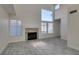 Bright living room features vaulted ceilings, fireplace, and large windows at 1989 Bookbinder Dr, Las Vegas, NV 89108
