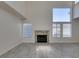 Bright living room features vaulted ceilings, fireplace, and large windows at 1989 Bookbinder Dr, Las Vegas, NV 89108
