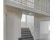 Staircase to second floor features steel railing and gray wood-look steps at 1989 Bookbinder Dr, Las Vegas, NV 89108