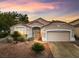 Charming home featuring a well-maintained front yard with desert landscaping and a two-car garage at 2008 Hobbyhorse Ave, Henderson, NV 89012