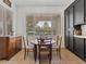 Cozy breakfast nook with a view, featuring a round table and dark wood cabinets at 2008 Hobbyhorse Ave, Henderson, NV 89012