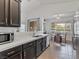 Bright kitchen with wood cabinets, tile floors, and a sunny breakfast nook at 2008 Hobbyhorse Ave, Henderson, NV 89012