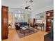 Bright living room with hardwood floors, large windows, ceiling fan, and elegant furniture at 2008 Hobbyhorse Ave, Henderson, NV 89012