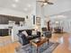 Bright living room with vaulted ceilings, a ceiling fan, and an open layout connecting to the kitchen at 2008 Hobbyhorse Ave, Henderson, NV 89012