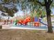 Fun playground with vibrant equipment, including a fish-themed climber and colorful slides at 2008 Hobbyhorse Ave, Henderson, NV 89012