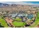 Expansive aerial shot of a recreation center surrounded by lush golf course and residential homes at 2147 Indigo Creek Ave, Henderson, NV 89012