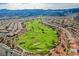 Expansive golf course and residential area nestled in the hills, offering stunning panoramic views at 2147 Indigo Creek Ave, Henderson, NV 89012