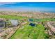 Scenic aerial view of lush green golf course and nearby neighborhoods and recreational amenities at 2147 Indigo Creek Ave, Henderson, NV 89012
