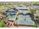 Overhead view displays tennis courts, community pool, and landscaping near the golf course in a desirable neighborhood at 2147 Indigo Creek Ave, Henderson, NV 89012