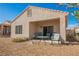 Inviting covered patio with seating, ideal for relaxing and entertaining in the low-maintenance backyard at 2147 Indigo Creek Ave, Henderson, NV 89012