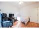 Second bedroom with an adjacent desk and wood-look floors at 2147 Indigo Creek Ave, Henderson, NV 89012