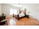 Spacious bedroom with a unique wooden bed frame and wood floors at 2147 Indigo Creek Ave, Henderson, NV 89012