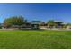 Community clubhouse with a well-kept lawn, offering a picturesque view of the gathering place and beautifully landscaped greenery at 2147 Indigo Creek Ave, Henderson, NV 89012