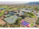 Community amenities featuring tennis courts, bocce ball court, swimming pool, and golf course with lush landscaping at 2147 Indigo Creek Ave, Henderson, NV 89012