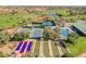 Aerial image shows tennis courts, bocce ball, pool, and nearby golf course, highlighting the active lifestyle at 2147 Indigo Creek Ave, Henderson, NV 89012