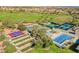 Aerial shot displays the community pool, tennis courts, bocce ball court, and adjacent golf course for active residents at 2147 Indigo Creek Ave, Henderson, NV 89012