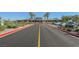 Well-maintained entrance to the community center, with landscaped grounds and a paved road at 2147 Indigo Creek Ave, Henderson, NV 89012