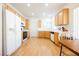 Spacious kitchen with white appliances, light wood cabinets, and ample counter space at 2147 Indigo Creek Ave, Henderson, NV 89012