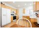 Functional kitchen features oak cabinets, white appliances, and a cozy eating area at 2147 Indigo Creek Ave, Henderson, NV 89012