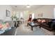 The living room showcases a comfortable seating arrangement with stylish decor and great light at 2147 Indigo Creek Ave, Henderson, NV 89012
