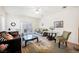 Cozy living room with a ceiling fan, sliding glass doors to the backyard, and stylish decor at 2147 Indigo Creek Ave, Henderson, NV 89012