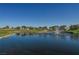 Community pond with fountain, manicured lawns, and blue sky at 2147 Indigo Creek Ave, Henderson, NV 89012