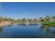 Serene community pond with fountain nestled among mature trees and lawns at 2147 Indigo Creek Ave, Henderson, NV 89012