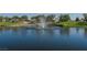 Beautiful community pond with fountain feature and lush green surroundings at 2147 Indigo Creek Ave, Henderson, NV 89012
