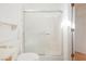 Shower with a built-in seat and a sliding glass door at 2147 Indigo Creek Ave, Henderson, NV 89012