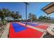 Outdoor shuffleboard court featuring colorful lanes, shaded seating, and well-maintained surroundings, ideal for active community engagement at 2147 Indigo Creek Ave, Henderson, NV 89012