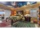 Bedroom with painted sky ceiling, large bed, rugs and doors to the backyard at 2151 Bannerwood St, Henderson, NV 89044