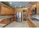Well-equipped kitchen with stainless steel appliances, granite counters, and ample cabinet space at 2151 Bannerwood St, Henderson, NV 89044
