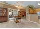 Kitchen and nook feature light-colored tile floors and access to the patio at 2151 Bannerwood St, Henderson, NV 89044