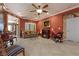 Comfortable living room with a fireplace, tile flooring, and an artistic ceiling at 2151 Bannerwood St, Henderson, NV 89044