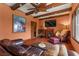 Comfortable living room with hardwood floors, a fireplace, and a decorative ceiling at 2151 Bannerwood St, Henderson, NV 89044