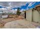 View of the backyard with a concrete patio area and some sparse landscaping at 218 S Bruce St, Las Vegas, NV 89101