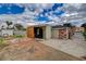 View of the backyard and the back of the home, plus the detached garage at 218 S Bruce St, Las Vegas, NV 89101