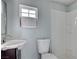 Bathroom with a sleek sink, toilet, and shower/tub combo plus a window at 218 S Bruce St, Las Vegas, NV 89101