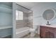 Updated bathroom with new tiling in the shower, new shelves and fixtures at 218 S Bruce St, Las Vegas, NV 89101