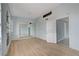 Bedroom with light blue walls, tile floors, and an open door leading to another room at 218 S Bruce St, Las Vegas, NV 89101