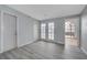Bedroom featuring wood-look flooring, backyard access and plenty of natural light at 218 S Bruce St, Las Vegas, NV 89101