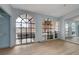 Primary bedroom with arched windows, tile floors and mirrors at 218 S Bruce St, Las Vegas, NV 89101